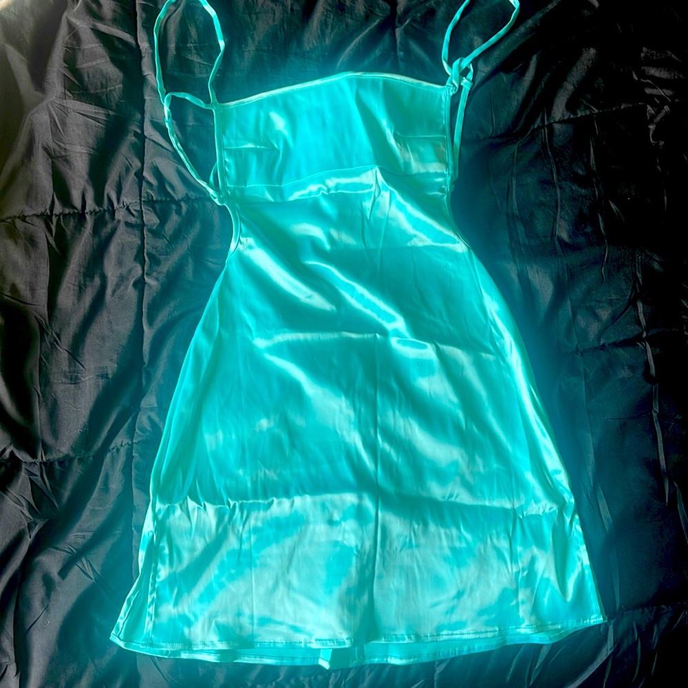 Satin, aqua colored mini dress. Size small. Never been worn. Fashion Nova.